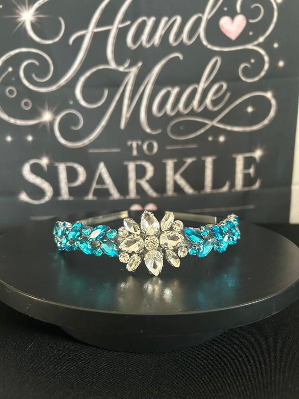 Bright blue headband with centre embellishment