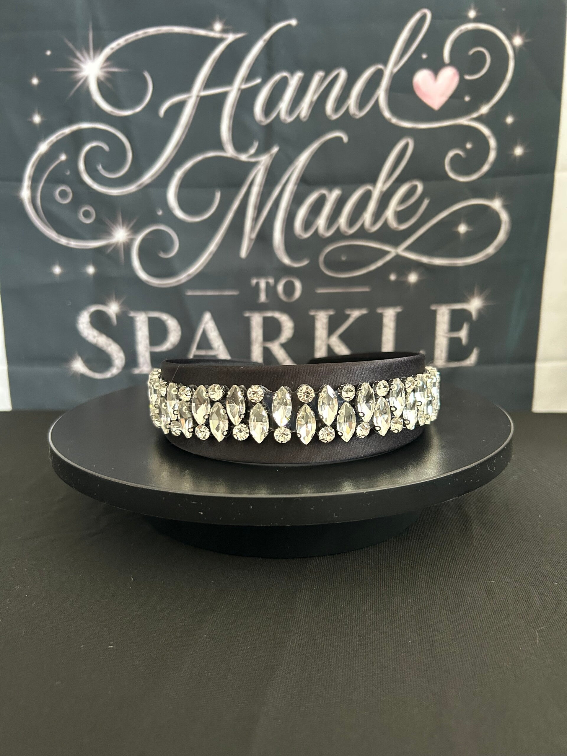 Black headband with silver trim