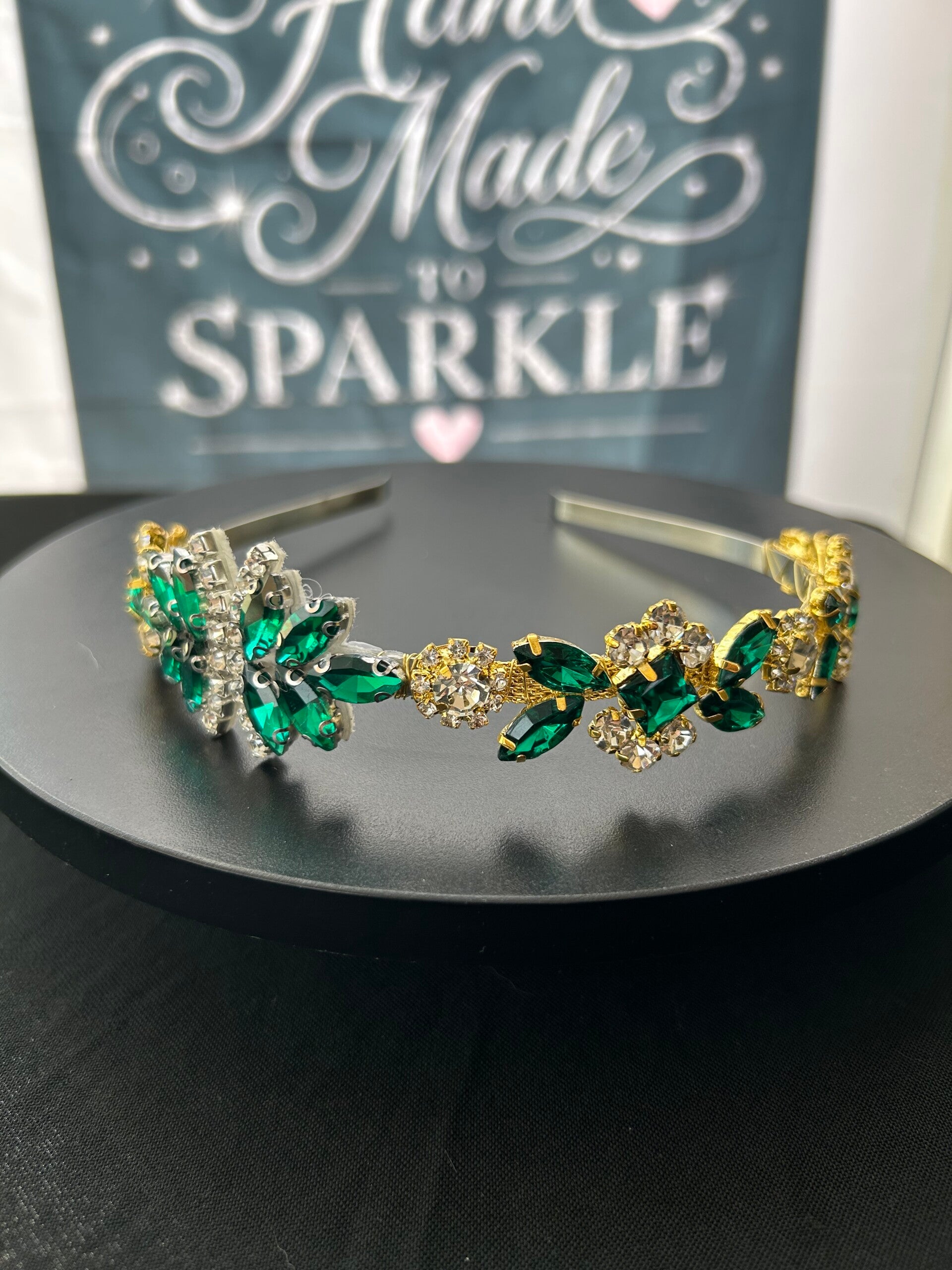 Green and gold headband with embellishment