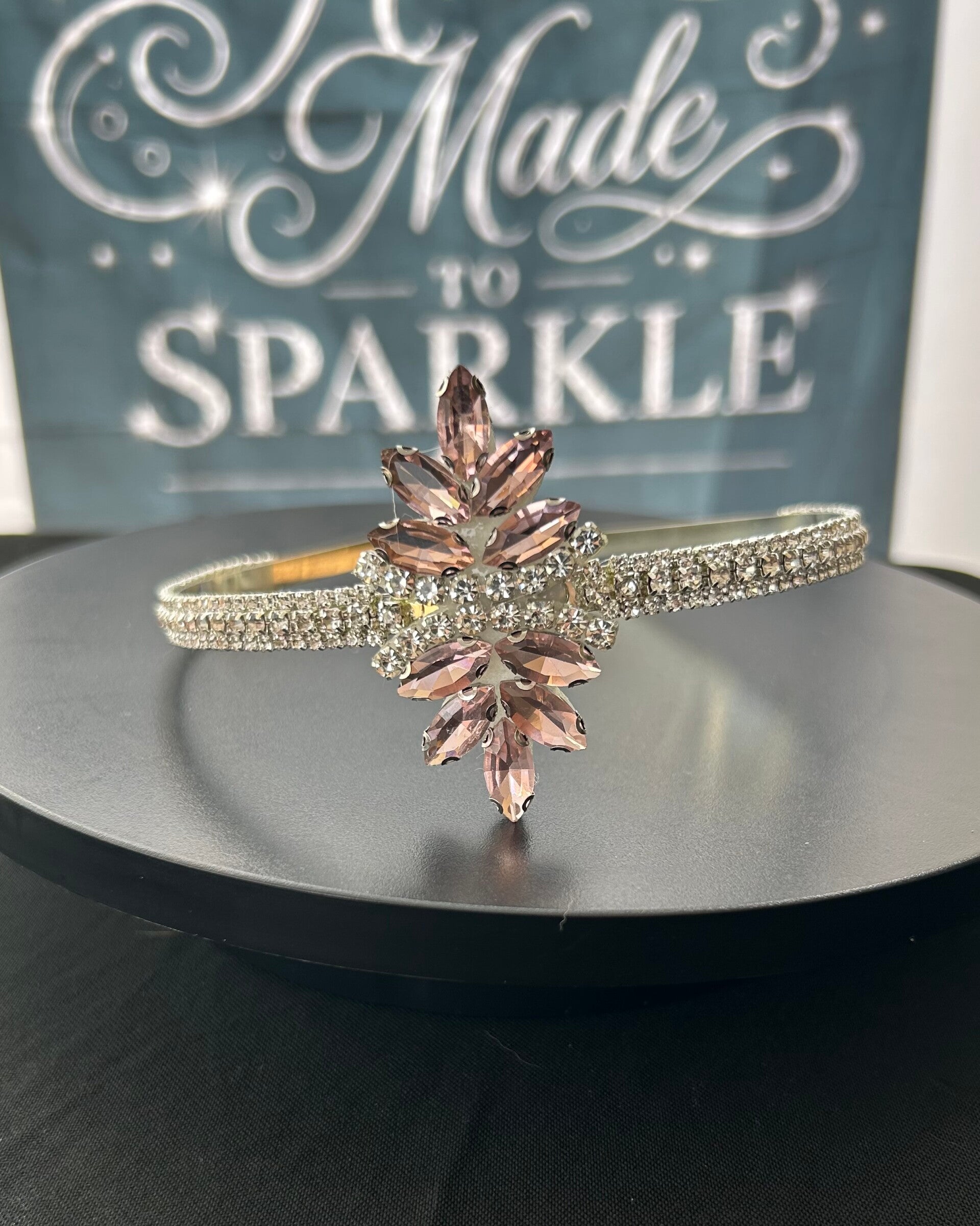 Silver headband with pink embellishment