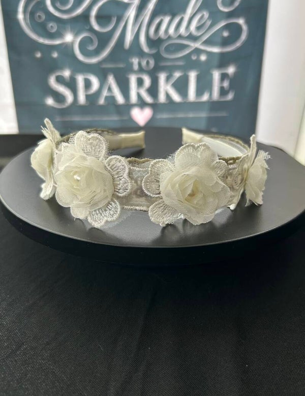 Green lace headband with flower embellishment
