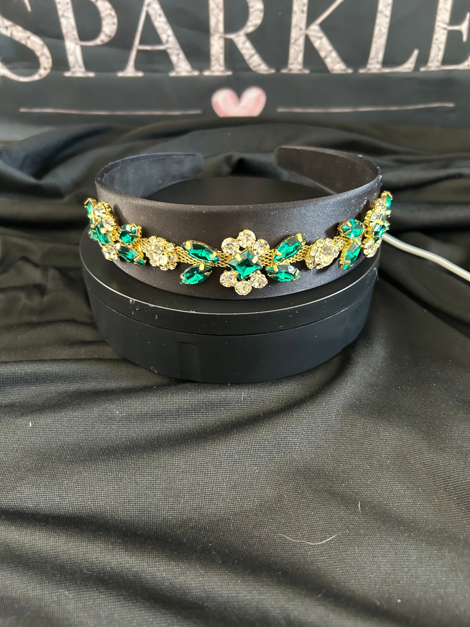Black headband with green trim