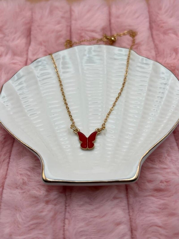 Goudkleurige ketting met rode vlinder