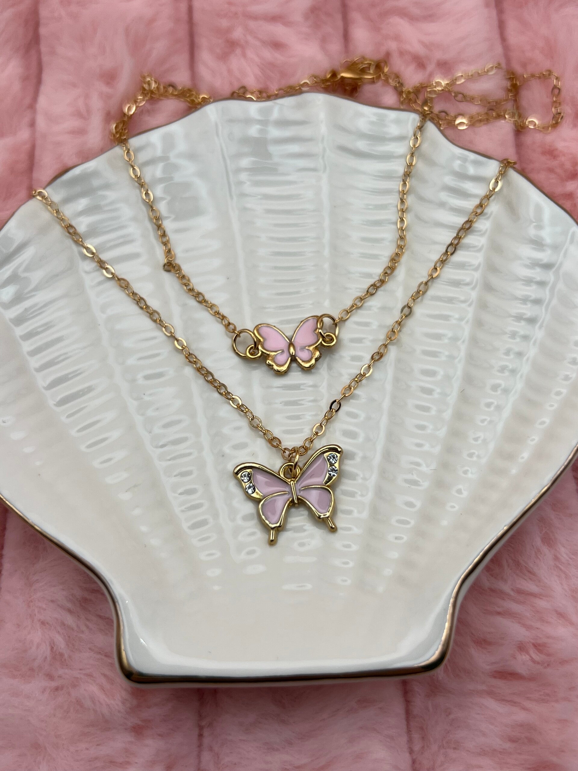 Goudkleurige dubbele ketting met roze vlinders
