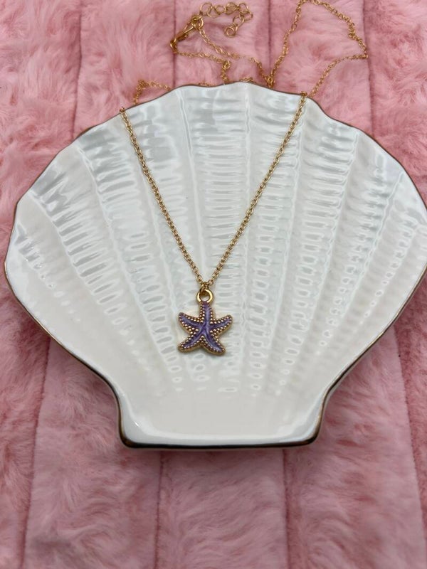 Goudkleurige ketting met paarse zeester