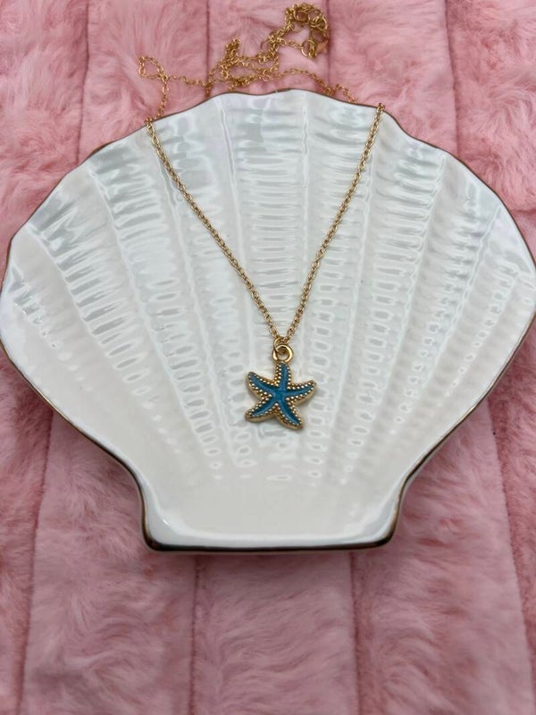 Goudkleurige ketting met turquoise zeester