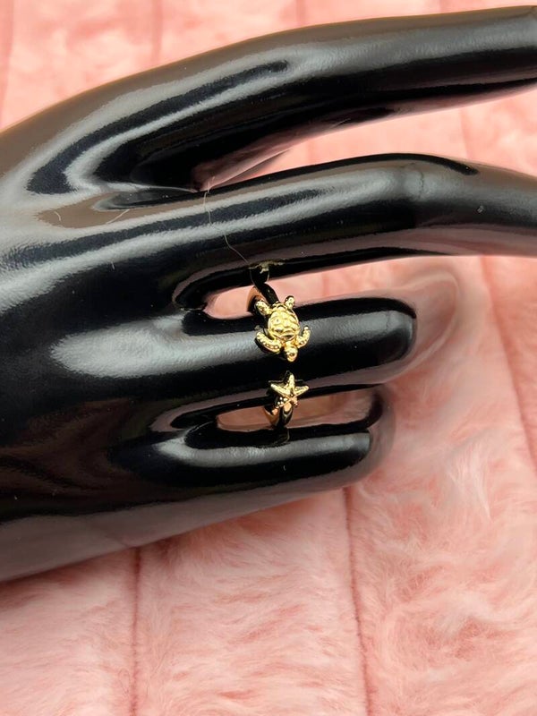 Goudkleurige verstelbare ring met schildpad en zeester