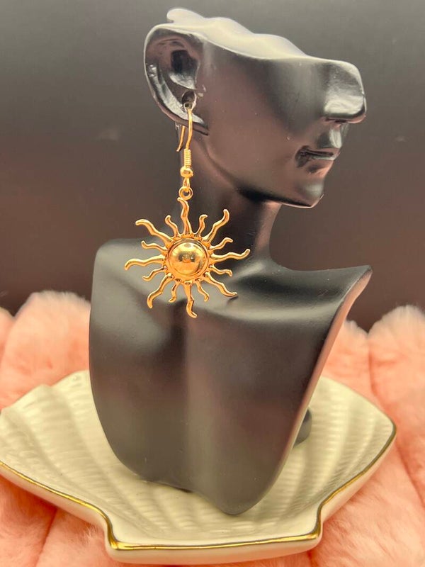 Goudkleurige zon oorbellen met lange hangers