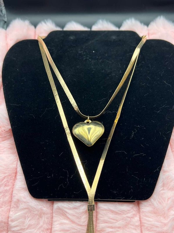 Goudkleurige lange layered ketting met hart
