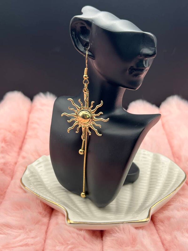Goudkleurige zon oorbellen met lange hangers