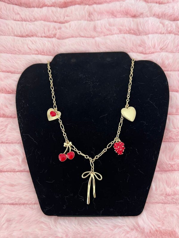 Goudkleurige bedelketting met kersen & strik