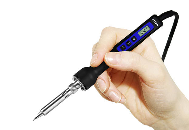 ATTEN ST-2065D soldering iron held in the hand, showing the LCD and the plus, minus and power buttons on the grip