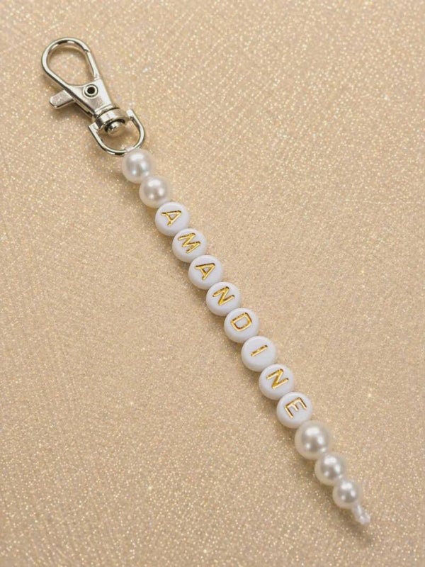 Porte clés lettre blanche et doré