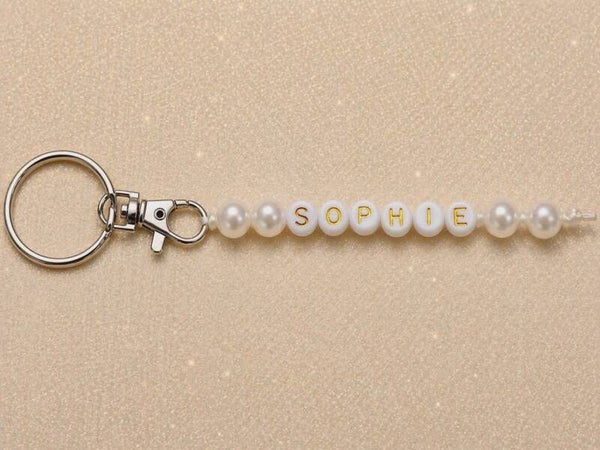 Porte clés lettre blanche doré