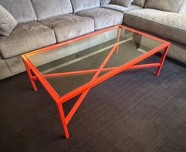 Colorful metal table with glass top