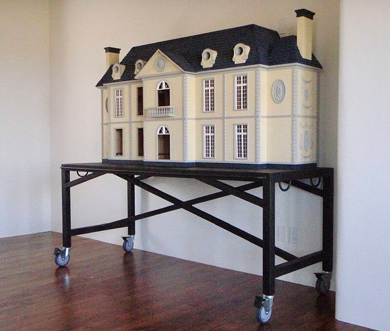 Metal cart to display dollhouse 