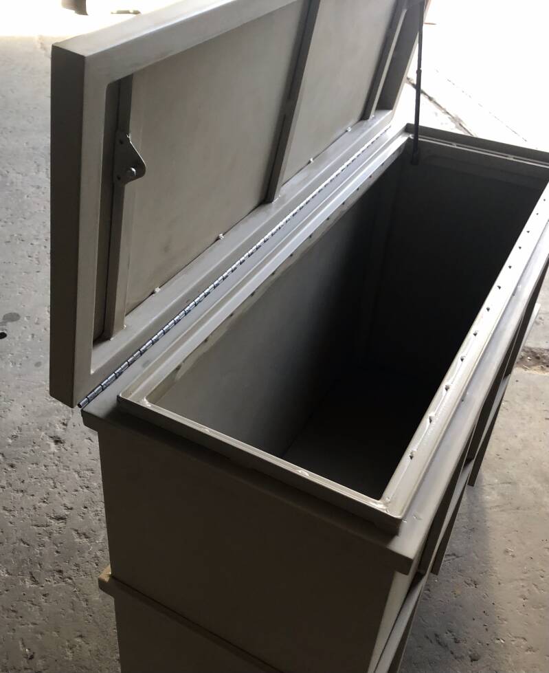 Detail of weather resistant freestanding chest with top open