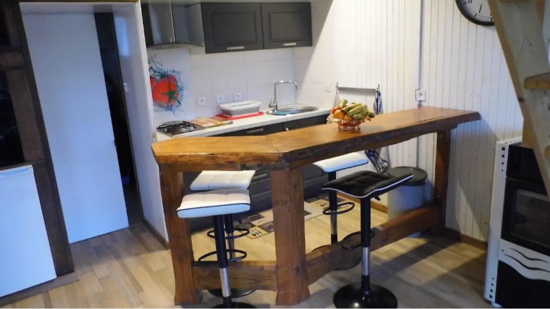 equipped kitchen with breakfast bar in a cottage in Sologne ideal for cooking and dining France