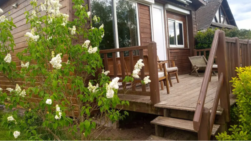 cottage for 4 people in Sologne with wooden terrace entrance and garden flowers France