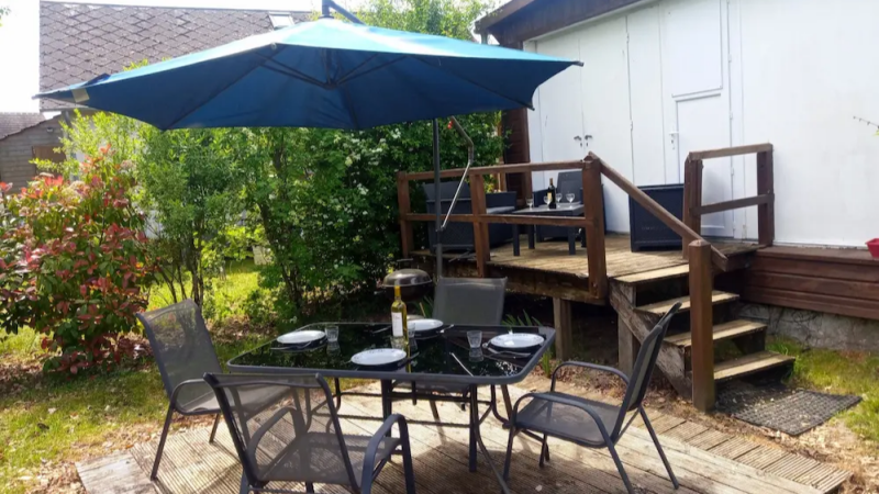 outdoor dining area with terrace and garden at a cottage in Sologne ideal for relaxing meals in France