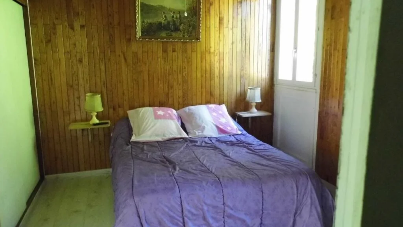 double bedroom in a cottage in Sologne with comfortable bed and natural light France