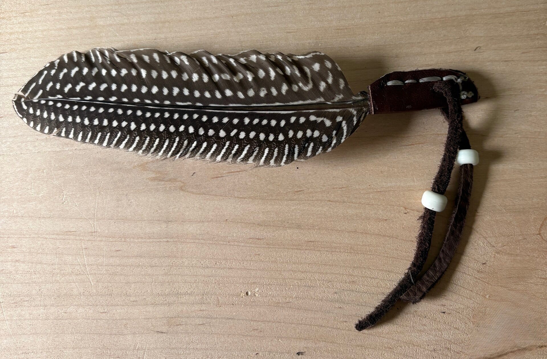 Leather Wrapped Guinea Hen Feather