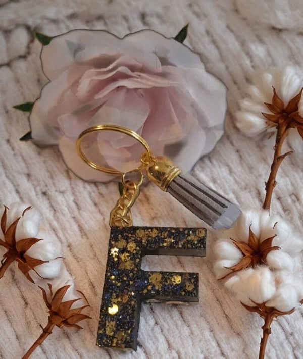Buchstabe Schlüsselanhänger F in Schwarz/Gold