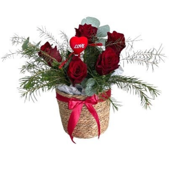 Basket with roses, greenery and heart stick