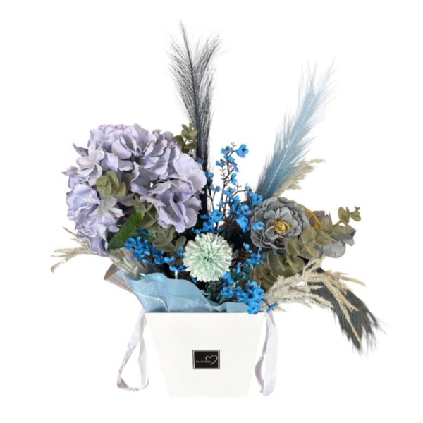 Paper box with artificial flowers in white and blue colour