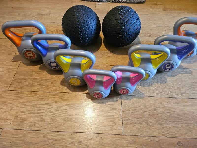 picture of kettlebells, and slam balls