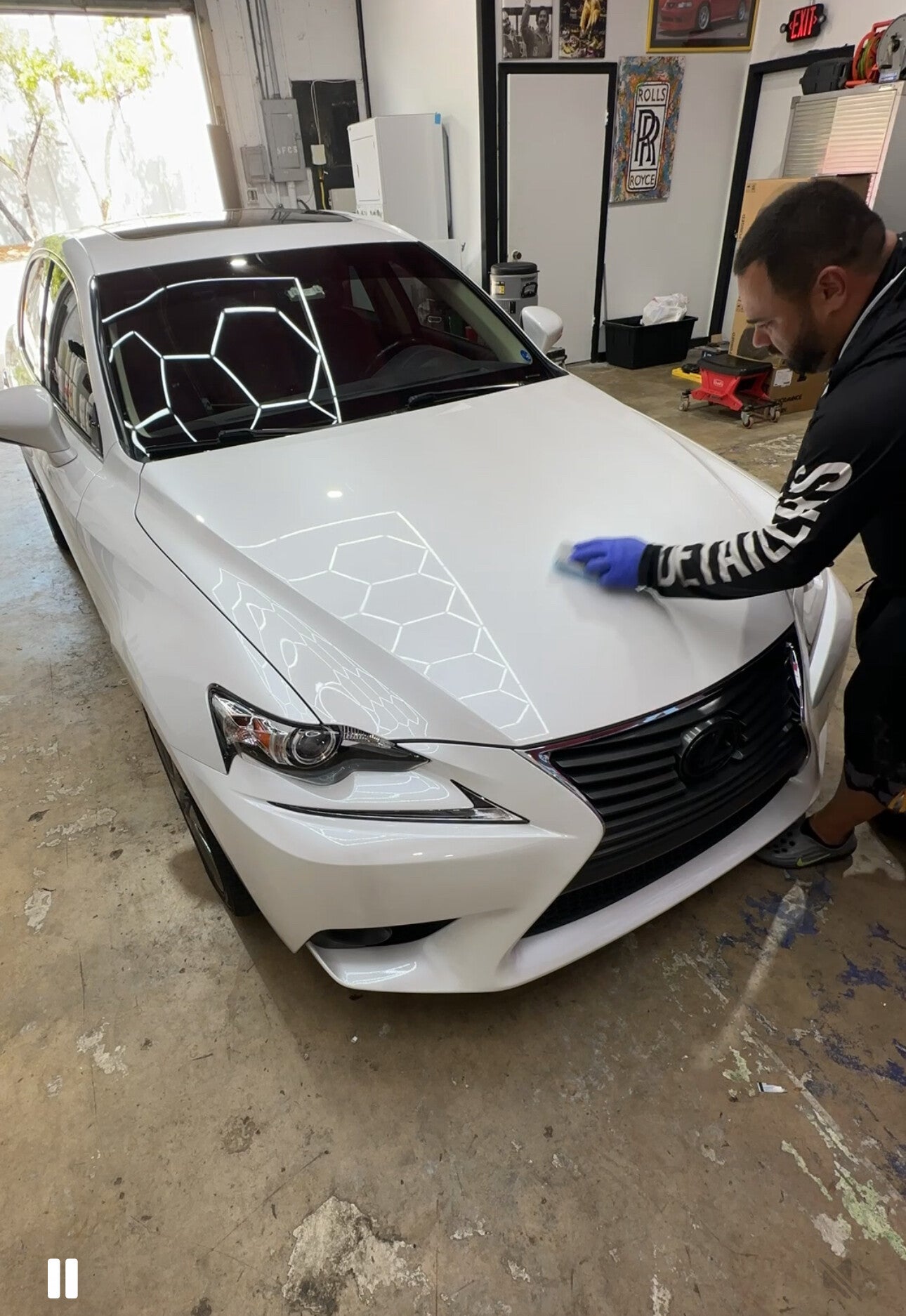 Xtreme Pro Detailers applying ceramic coating to a white Lexus for enhanced gloss and long-lasting paint protection in Miami