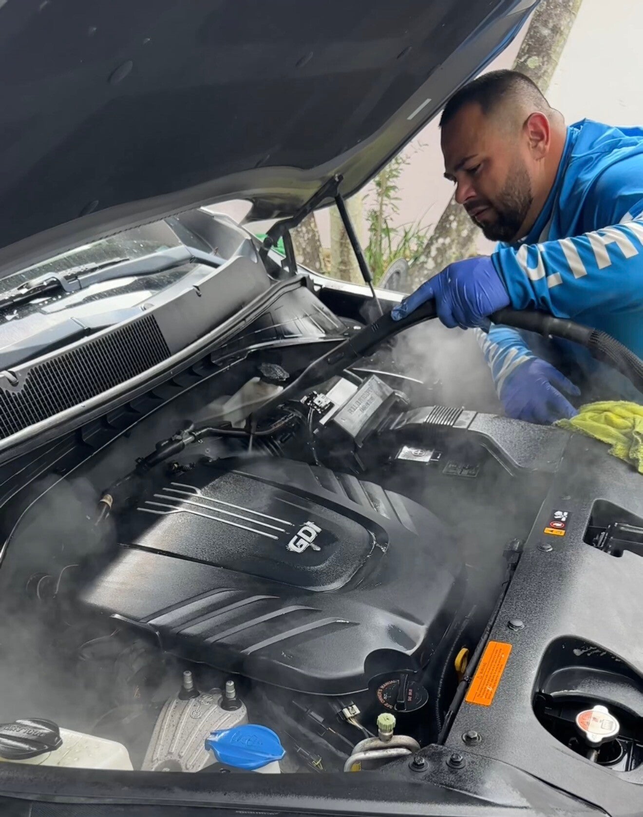 Xtreme Pro Detailers performing professional engine bay detailing to remove dirt, dust, grease, and buildup in Miami