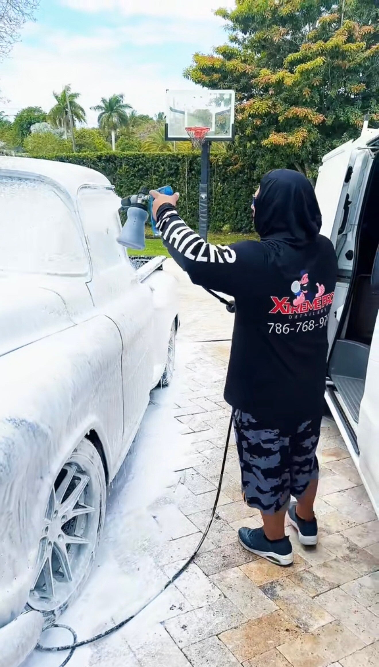 Xtreme Pro Detailers performing a mobile exterior pre-wash with a foam cannon in Miami