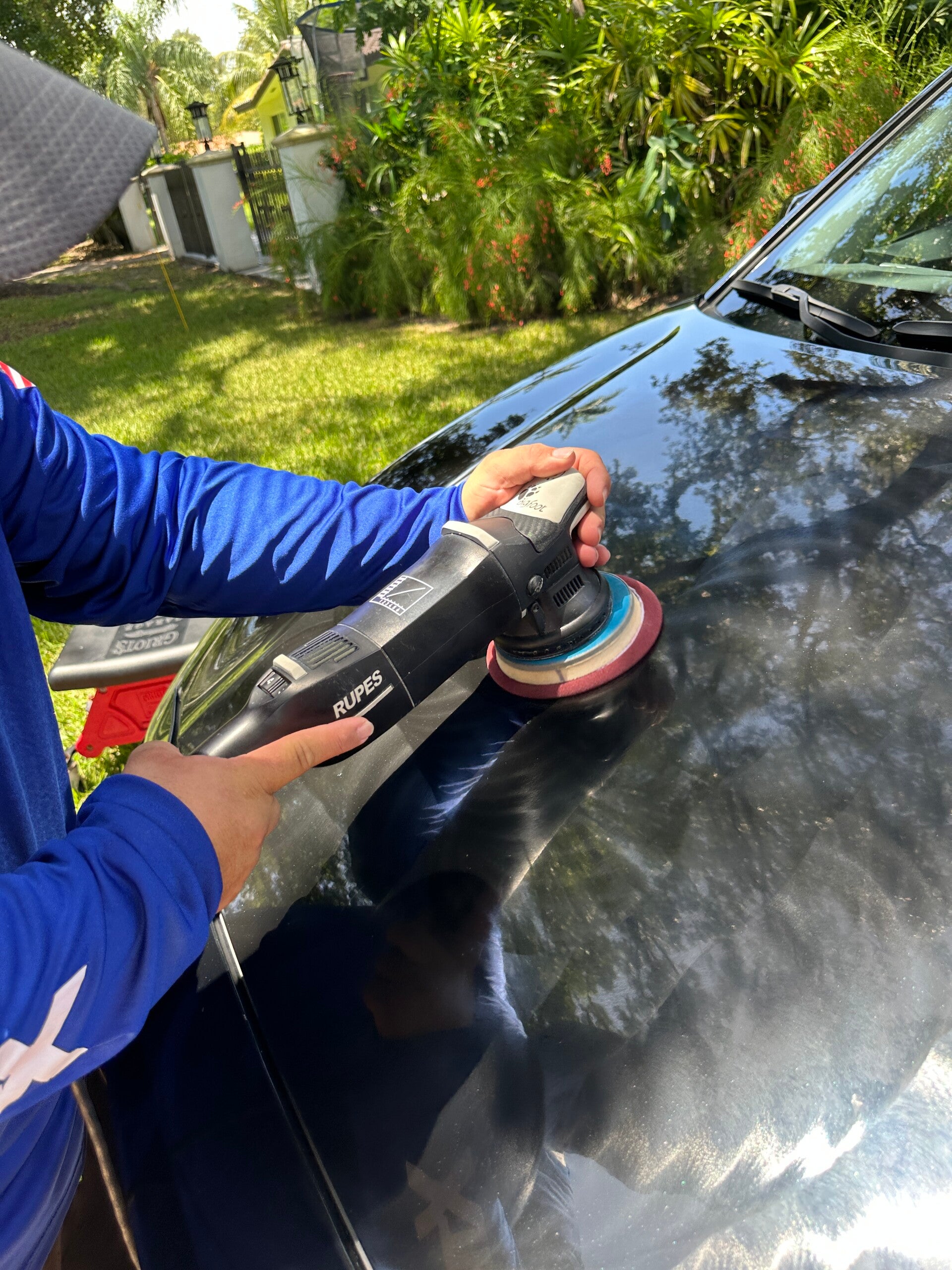 Xtreme Pro Detailers machine polishing vehicle paint to improve gloss and reduce light haze and minor imperfections in Miami