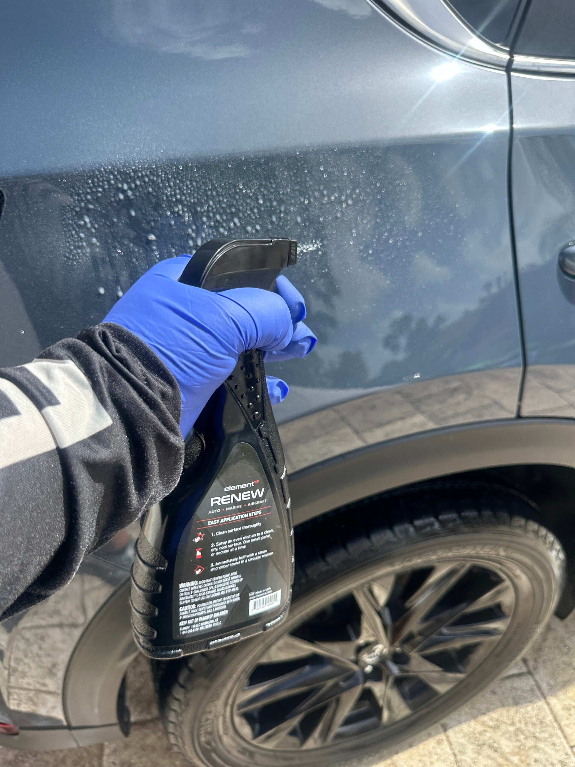 Xtreme Pro Detailers applying ceramic spray sealant for added gloss and water-beading protection in Miami
