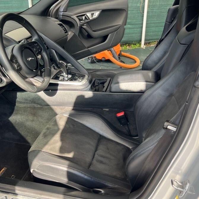 Jaguar F-Type cabin after mold restoration with clean seats and console