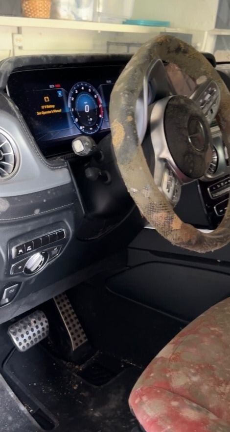 Mercedes-Benz G-Class steering wheel and dashboard covered in mold before restoration