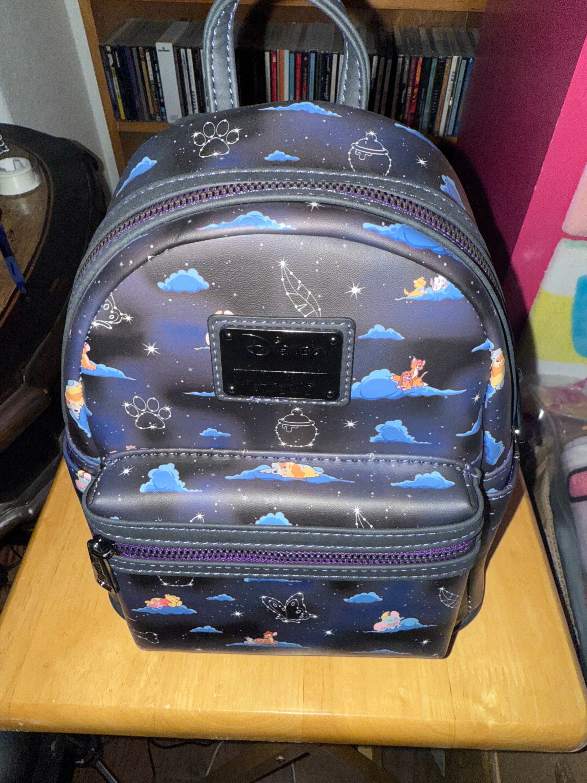 Loungefly Disney Classic Clouds AOP Mini Backpack.