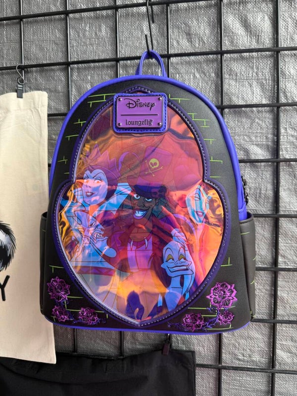 This Loungefly Disney Villains Stained Glass Glow Mini Backpack