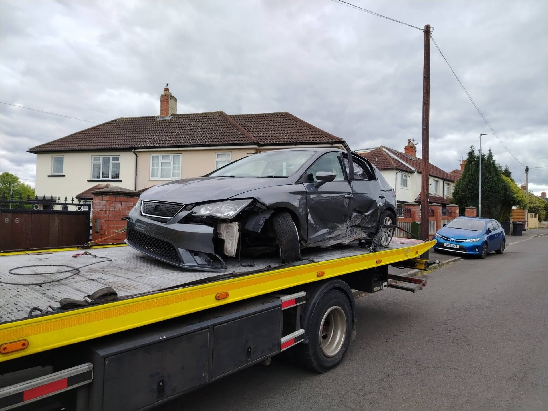 SLK Recovery Vehicle with a accident damaged vehicle on the back.