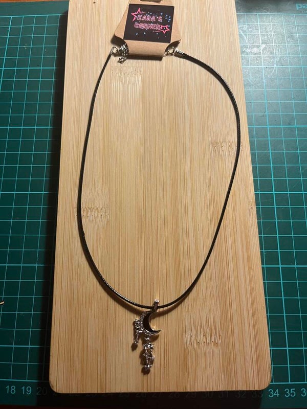 Lace necklace with black and silver pendant