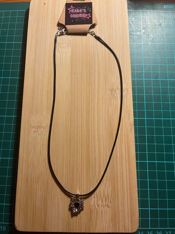 Lace necklace with black and silver pendant