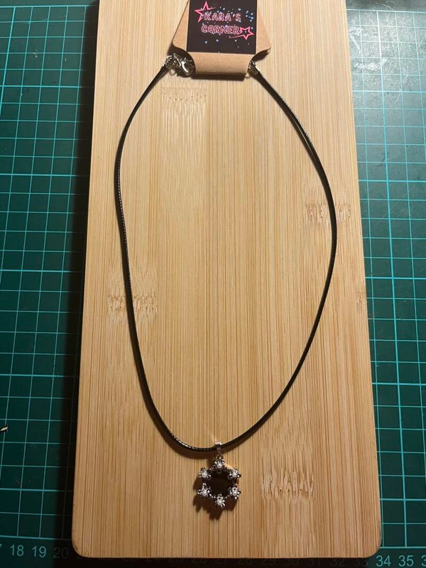 Lace necklace with black and silver pendant
