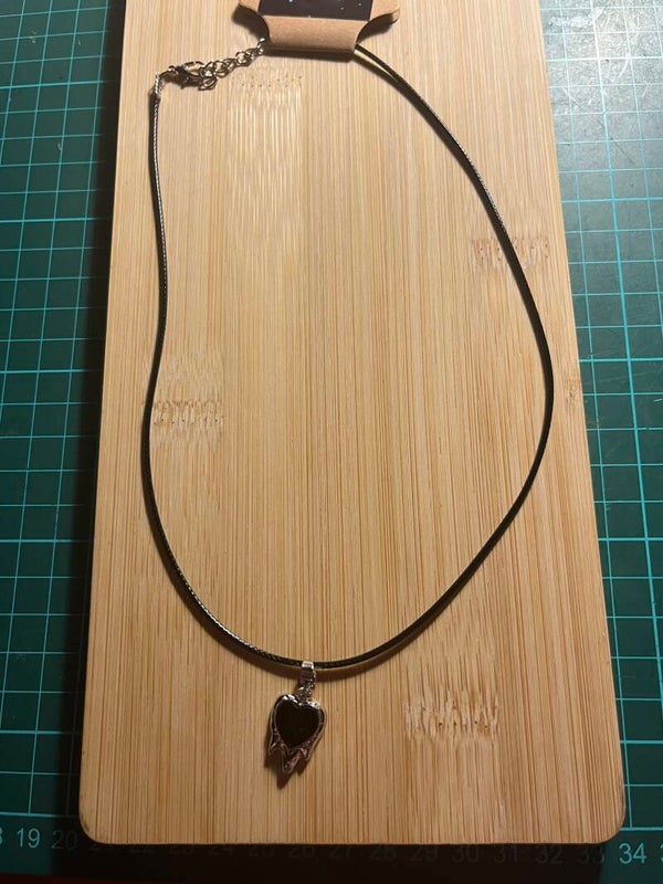 Lace necklace with black and silver pendant