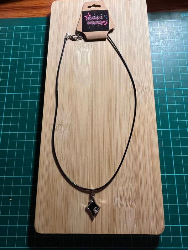 Lace necklace with black and silver pendant