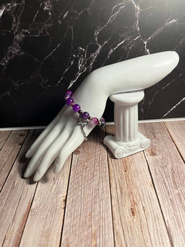 Glass bead bracelet with metal charm