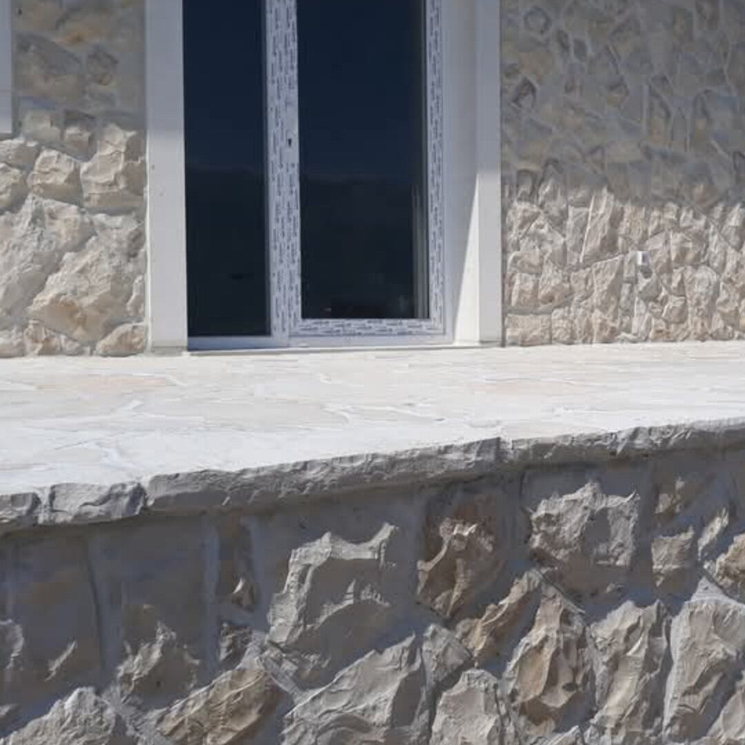 URSA Naturstein Fassade aus kroatischem Kalkstein