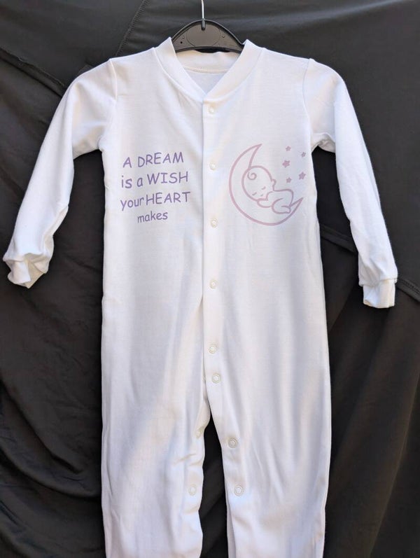 Baby sleeing on the Moon Babygrow