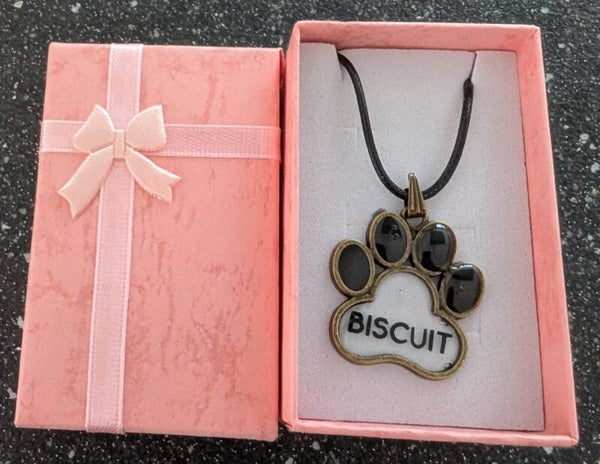 Paw print shaped pendant with rope necklace