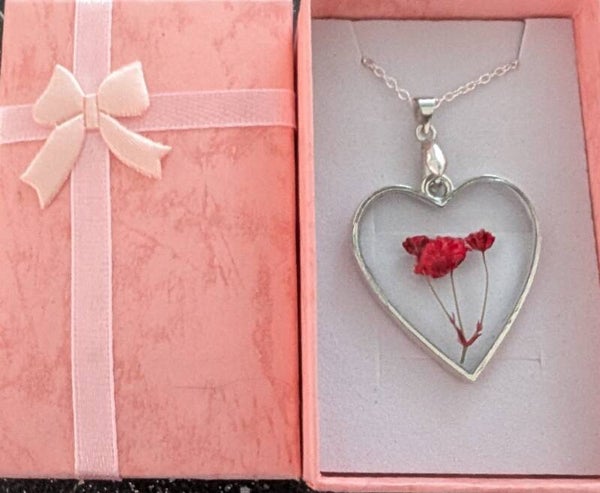 Heart Shaped resin pendant finished with dried flowers